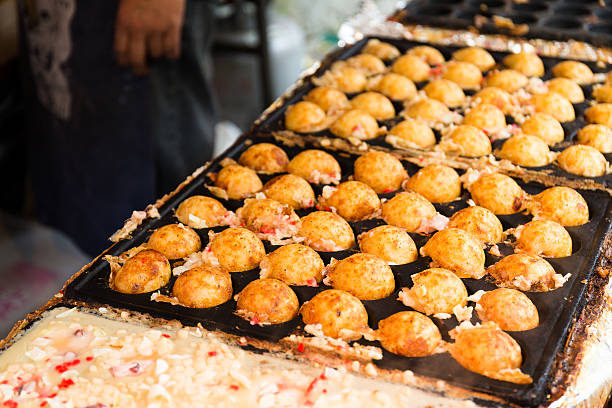 istock Close-Up Of Man Making Takoyaki 623757660