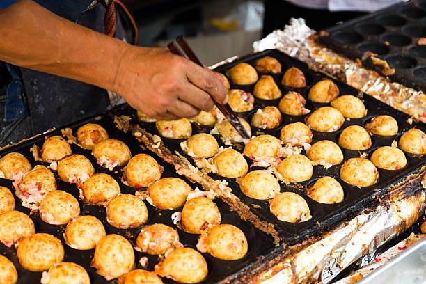 istock Close-Up Of Man Making Takoyaki 623757726