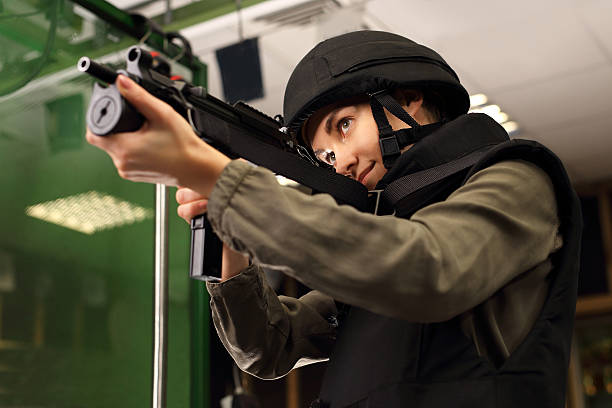 istock Woman shoots a rifle at the shooting range 623757972