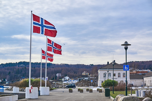 Larvik, Norway - April 5, 2015: Traditional buildings. Name of the fjord - Larviksfjorden. Town in Vestfold county, Norway. Larvik harbor in spring, Norway