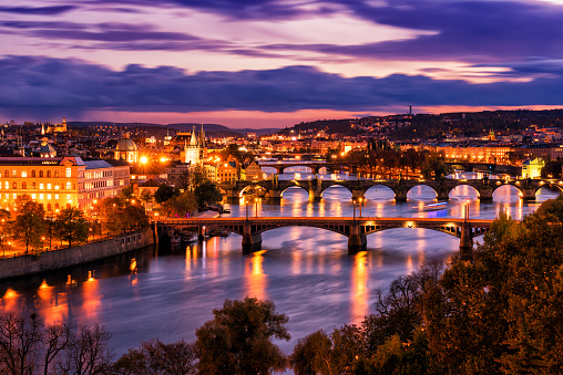 Aerial view of Prague old town architecture and bridges over Vltava river, night cityscape, Czech Republic, Europe