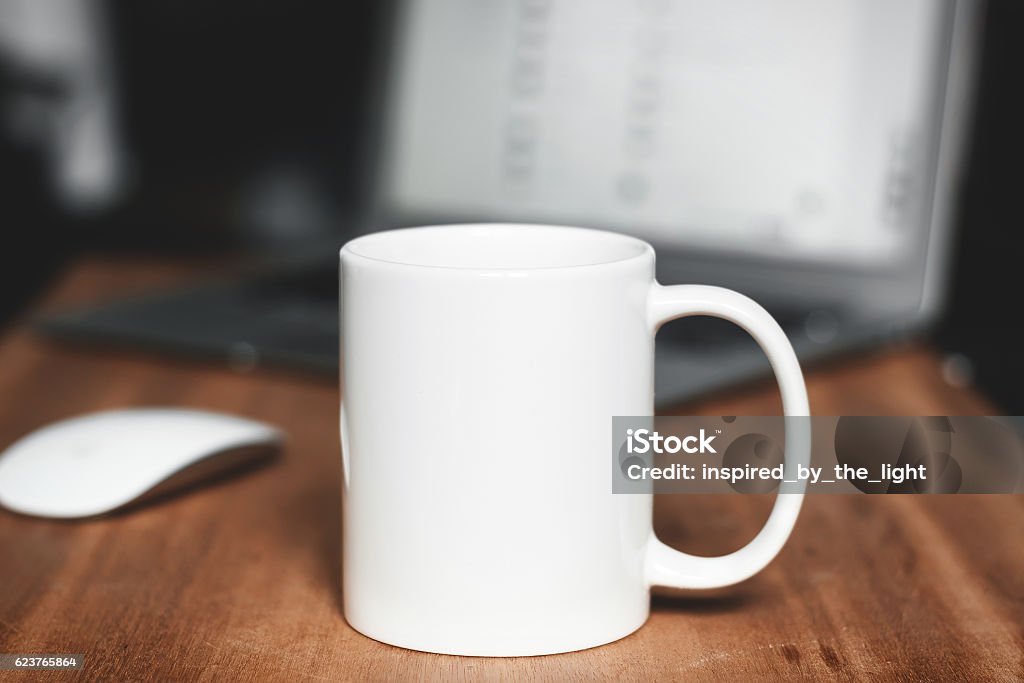 White mug on the desktop Office background Mug Stock Photo