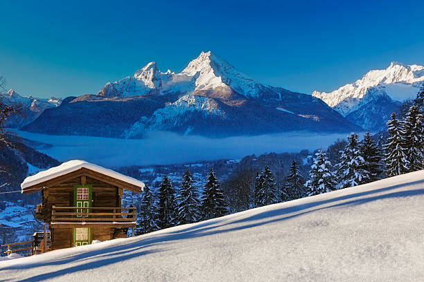 Panoramic view of beautiful winter wonderland mountain scenery in the Alps
