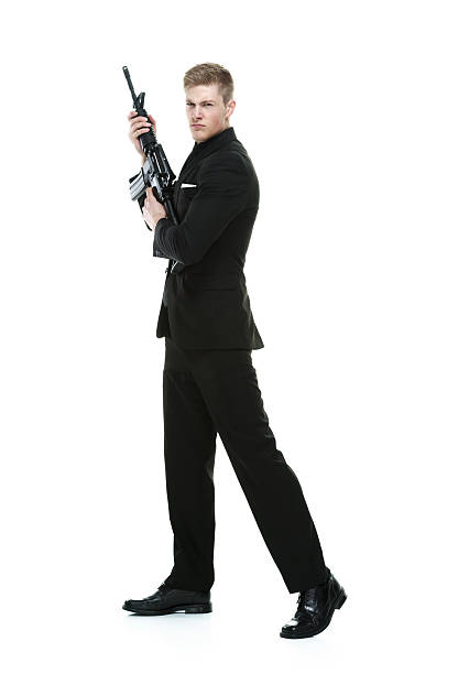 istock Angry businessman holding rifle 623767780