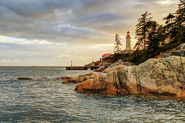 Point Atkinson Lighthouse at sunset after thunderstorm, West Vancouver, BC Point Atkinson Lighthouse at sunset after thunderstorm, Lighthouse Park, West Vancouver, BC west vancouver stock pictures, royalty-free photos & images