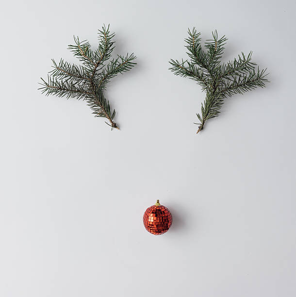 istock Reindeer face made of Christmas decoration and pine branches. Mi 623773556
