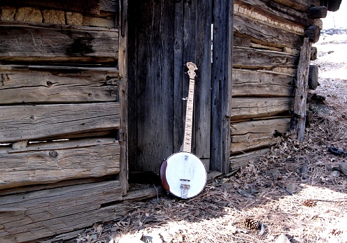 Banjos and old cabins go together well for bluegrass and blues music. This is a picture of my banjo at an old mining cabin up in the