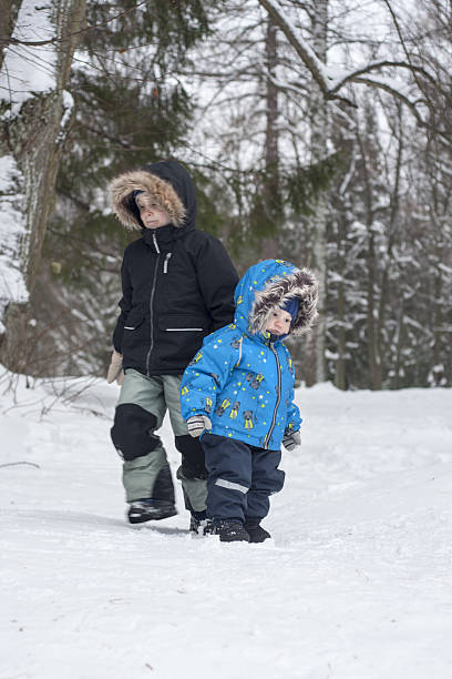 istock Two brothers in winter snow forest 623775756