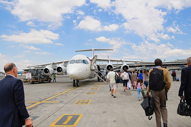 Passengers are boarding the aircraft of South African Airways stock photo