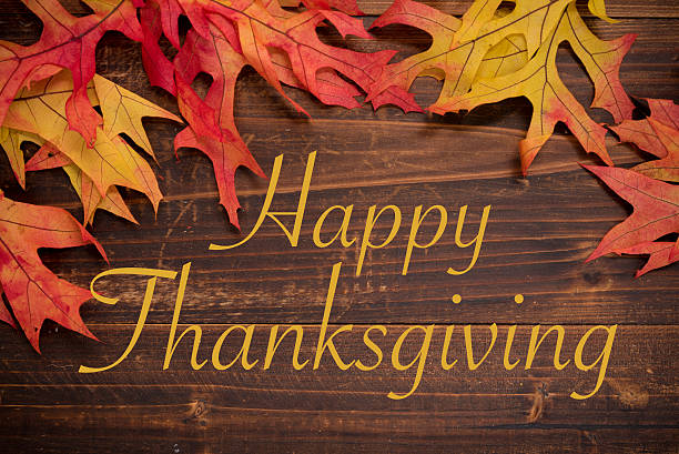 istock Autumn leaves on a wooden background forming a border 623777556