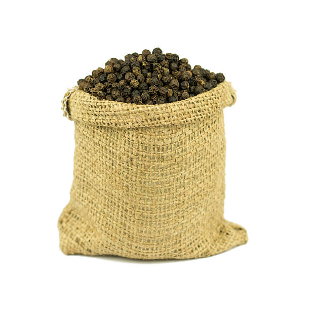 istock Black pepper in Jute bag bowl isolated on white background 623778272