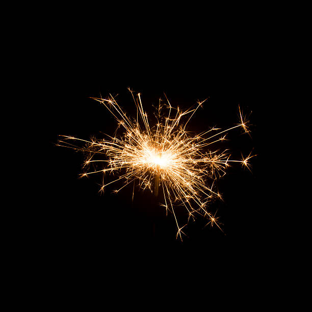 istock Burning sparkler isolated on black background 623778354