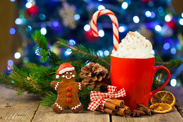 istock Christmas cappuccino and gingerbread cookies infront Christmas tree 623779292