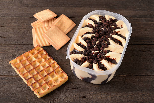 istock Pan with vanilla ice cream chocolate sprinkles and waffle iron 623781020