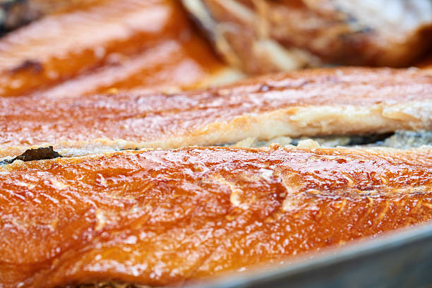 istock Smoked fish in a tin pan. Smoked herring 623781898