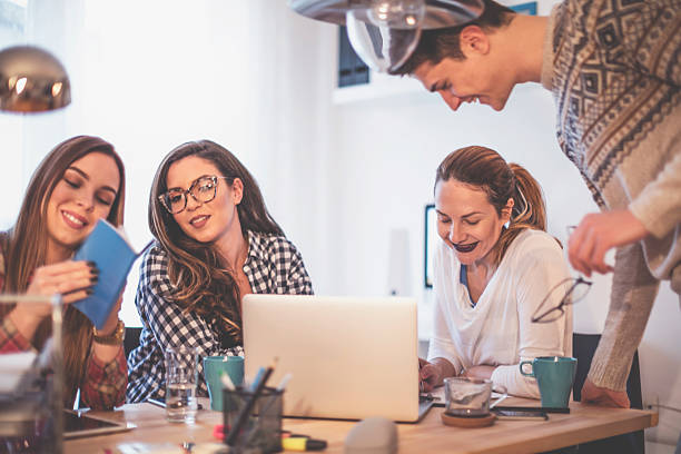 istock Group of young people working together 623783238
