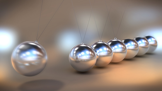Illustration of a Newton's cradle in close up view