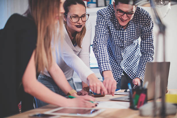 istock Group of young people working together 623783644