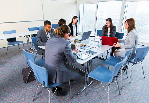 istock Business people in education room talking about their problems 623822196