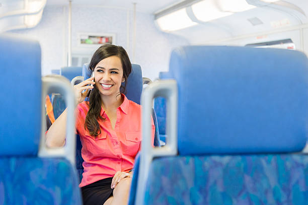 istock Women On A Train Using On Her Cell Phone 623822296