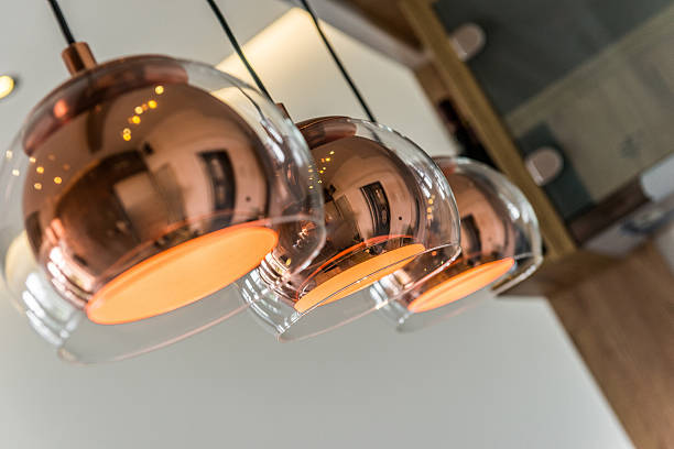 Three chandeliers or lamps in modern home interior