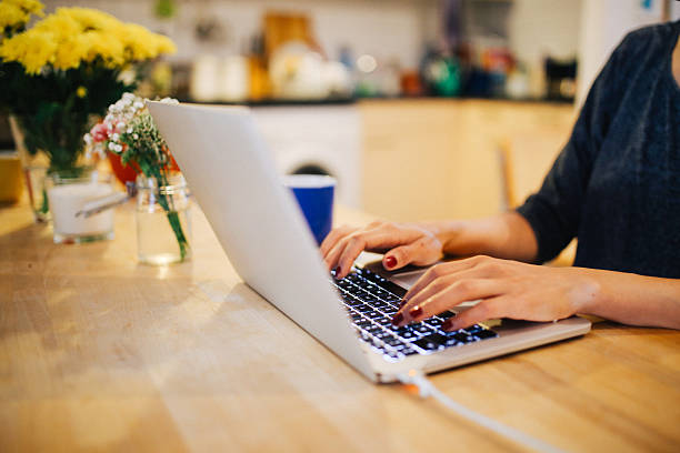 istock Young woman having a coffee and working at home 623823028