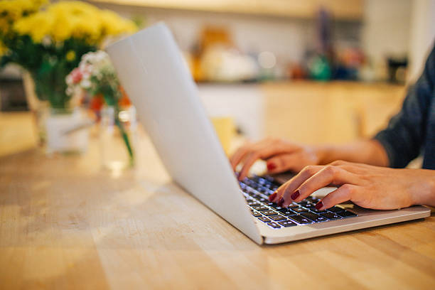 istock Young woman having a coffee and working at home 623823134