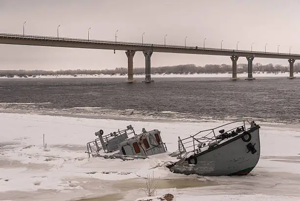 Photo of Sunken boat in a frozen river