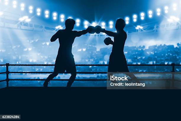Silhouette Of Two Professional Asian Boxer Fight In The Boxing Stock Photo - Download Image Now