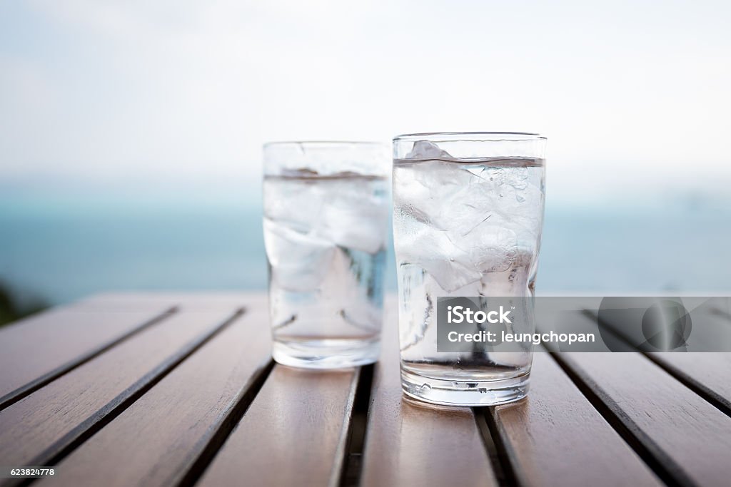 Glass of water on table in restaurant Cold Drink Stock Photo