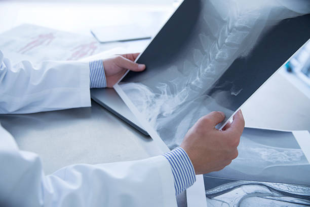 istock Doctor watching the X-ray on the neck 623825586