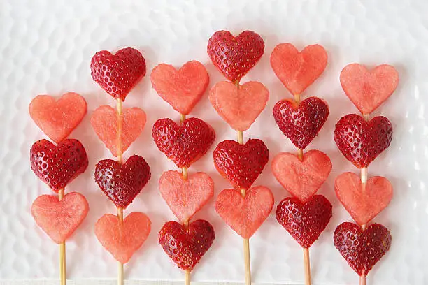 Photo of heart shape strawberry and watermelon fruit  skewers