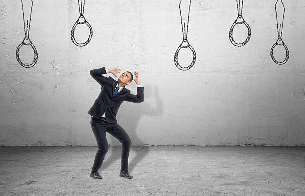 istock Businessman surrounded by ties drawn on wall, which look like 623828384