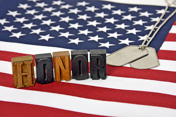 istock honor military dog tags on flag 623829736