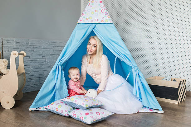 istock Parents with children in a teepee 623845530