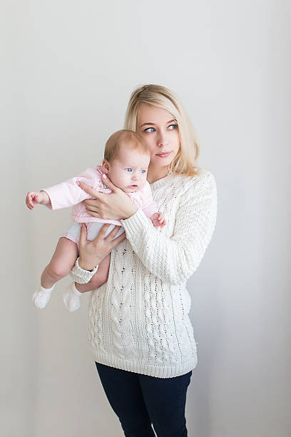istock mother playing with her baby 623846004