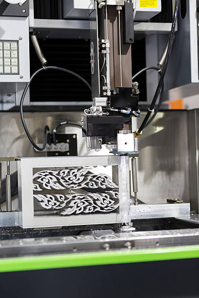 istock CNC wire cut machine cutting mold parts 623846190