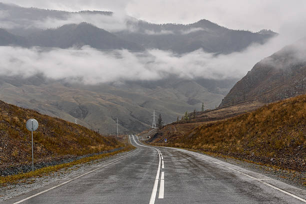 istock road mountains fog asphalt cloudy 623846388