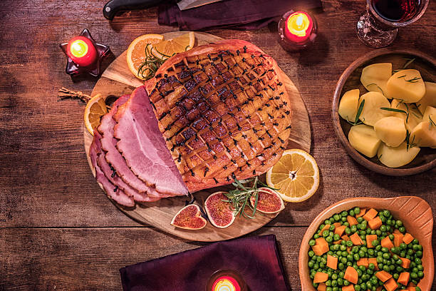 istock Glazed Holiday Ham with Cloves Served for Dinner 623846766