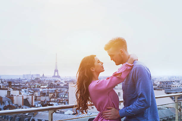 istock romantic couple in Paris, happy moment on Eiffel Tower background 623847274