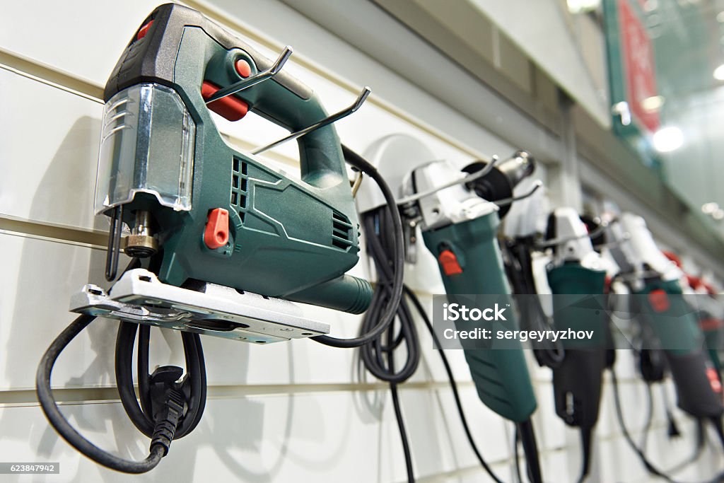 Electric tools for construction on stand in shop Electric tools for construction on the stand in the shop Store Stock Photo