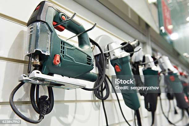 Electric Tools For Construction On Stand In Shop Stock Photo - Download Image Now - Store, Shopping, Work Tool
