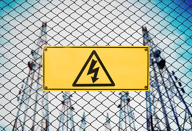 istock High Voltage Sign and Symbol Caution Signboard on Fence Wire 623847972