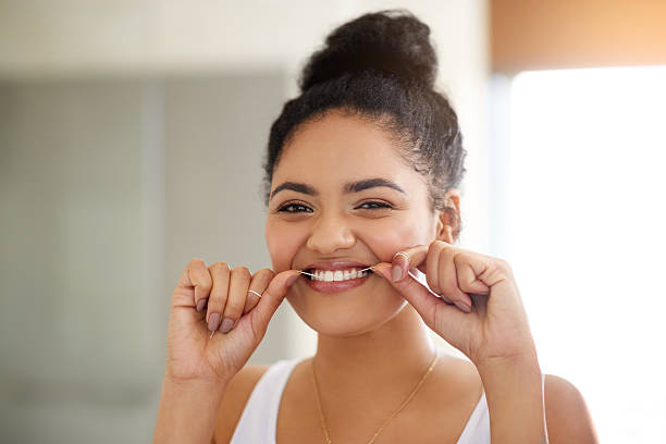 abitudini sane, denti sani - human mouth human teeth indoors young women foto e immagini stock