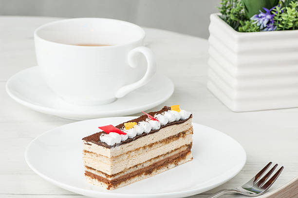 istock cake in a plate and a cup on the table 623848522