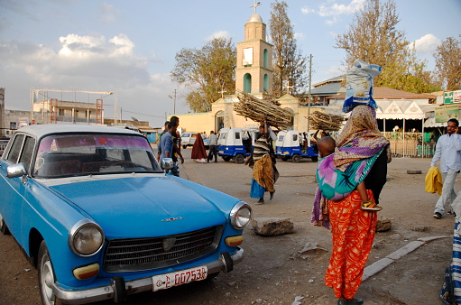 Harar, Ethiopia - March 28th, 2012: Unidentified people pass across city square in Harar, Ethiopia, March 28, 2012.