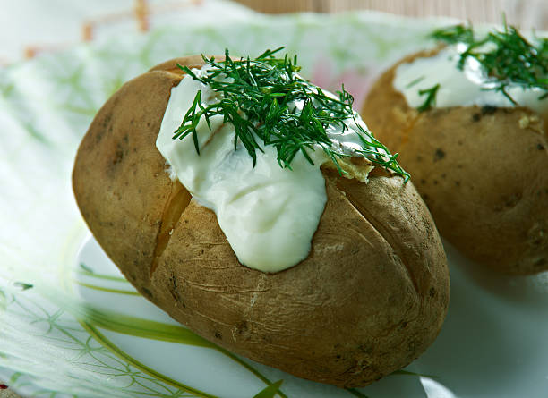 Finnish baked potatoes uuniperuna - Finnish baked potatoes baked potato sour cream stock pictures, royalty-free photos & images