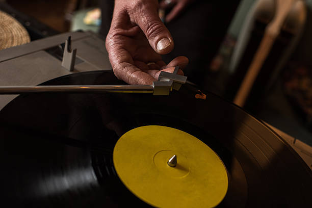 close up of playing music on a turntable. - old record imagens e fotografias de stock