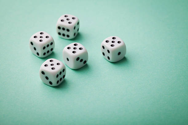 istock White dice on green background. All number five. Casino concept. 623864746