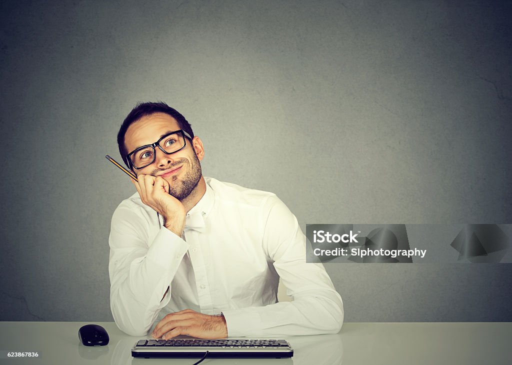 young funny business man thinking daydreaming Attention Deficit Hyperactivity Disorder Stock Photo